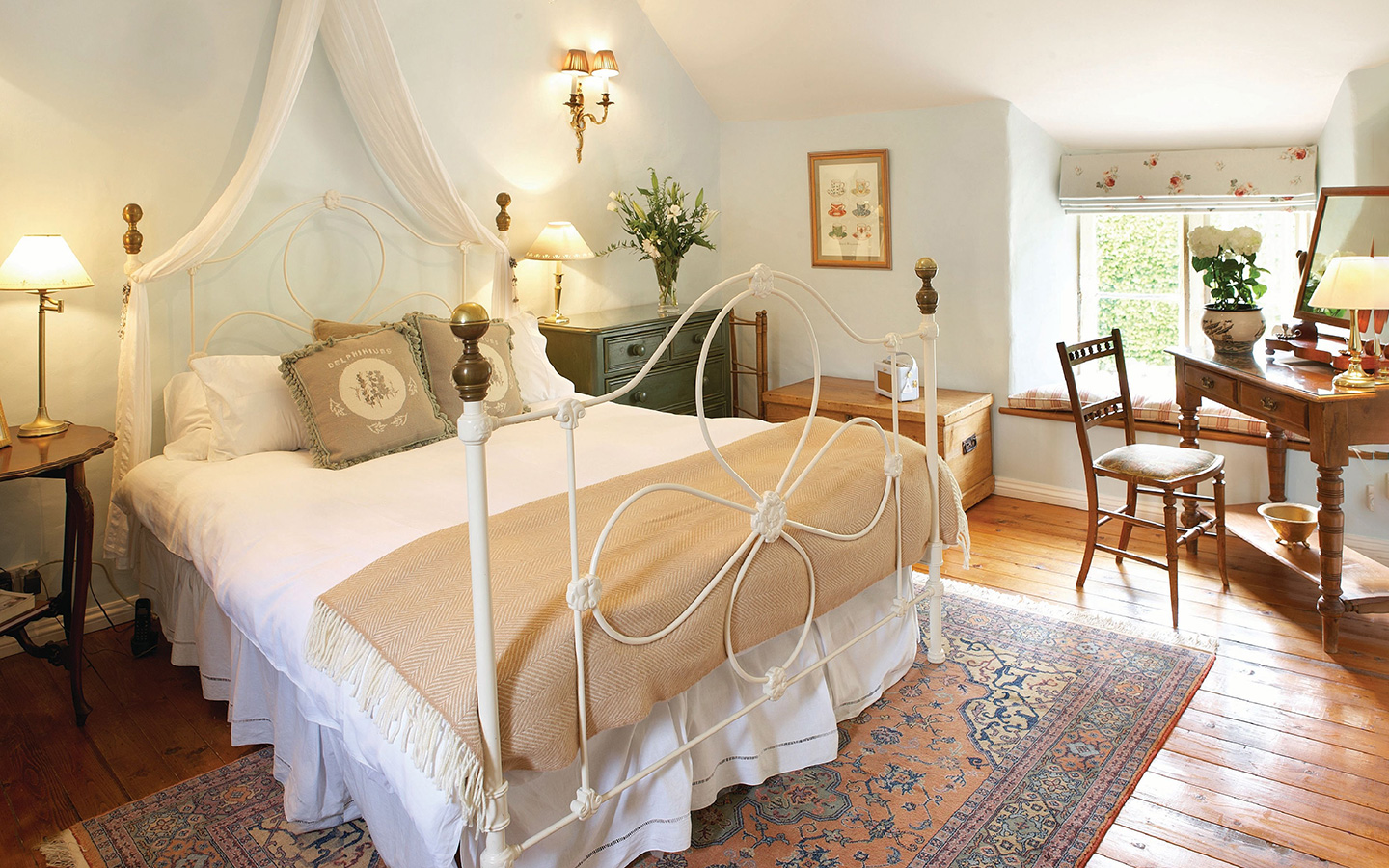 The romantic main bedroom at Jasmine Cottage in the Cotswolds