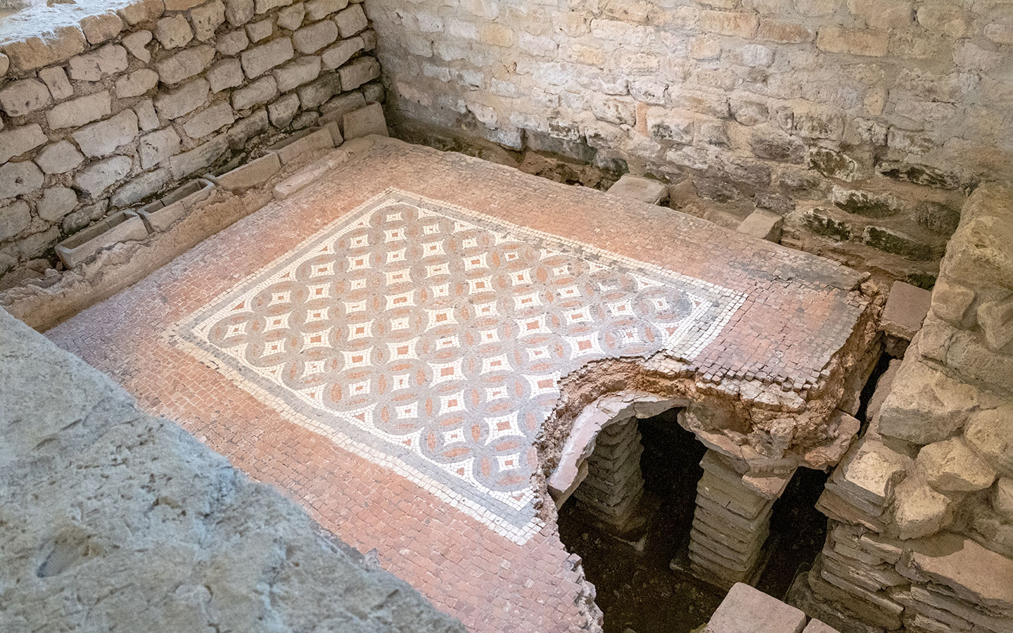 The hypocaust beneath the mosaics in Roman bathhouse at Chedworth