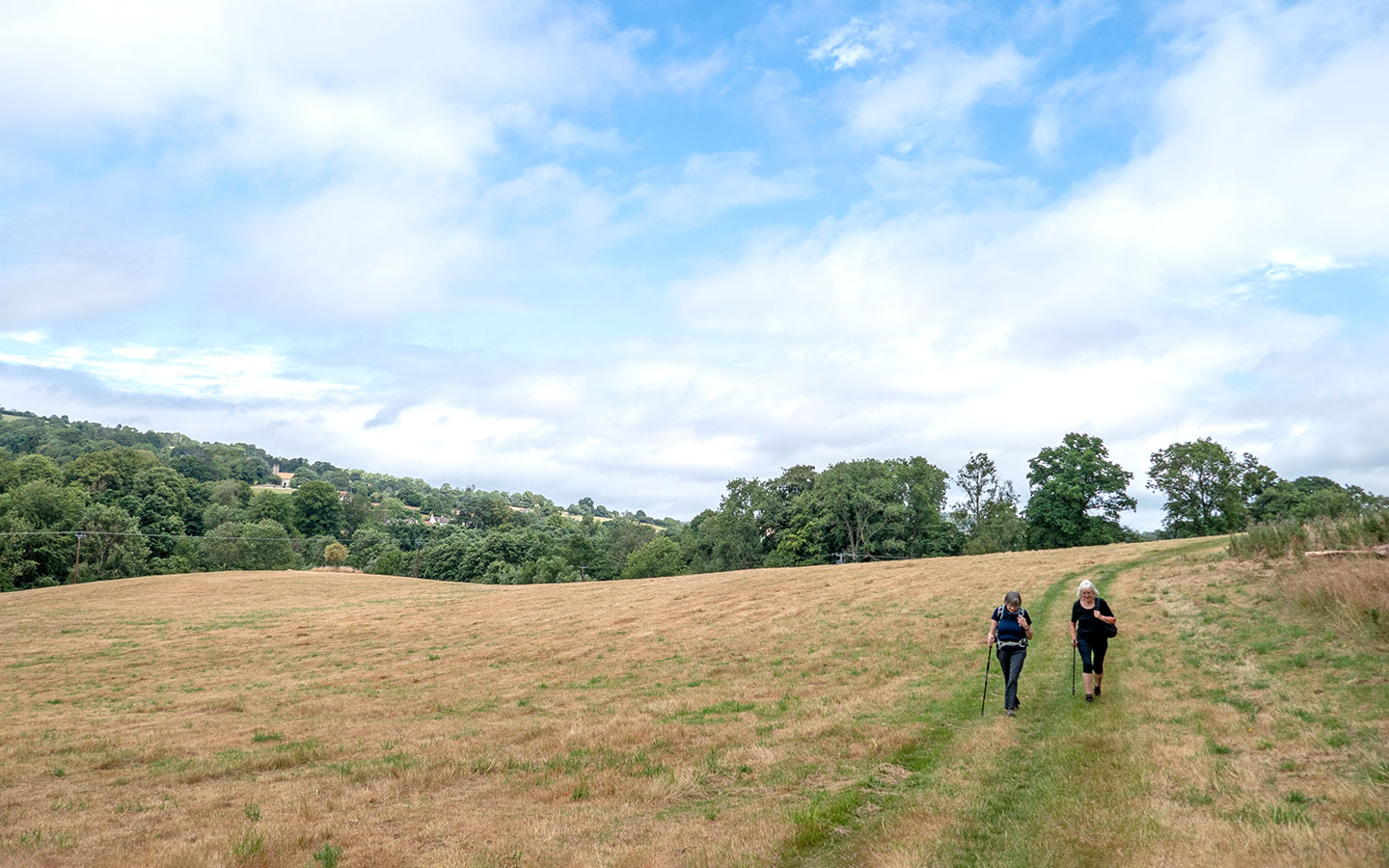 Walking across fields towards Slad on the Painswick to Slad walk