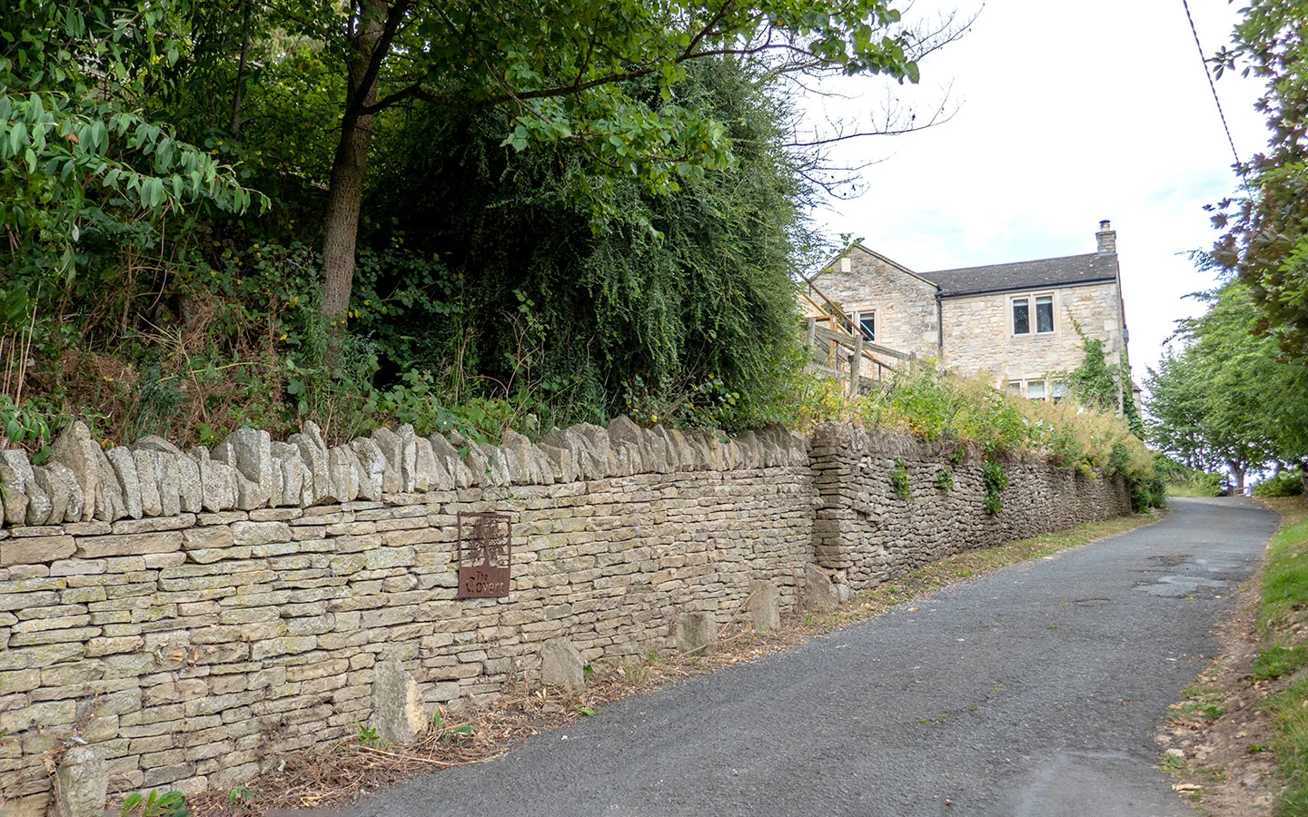 The Covert house with stone wall in Slad