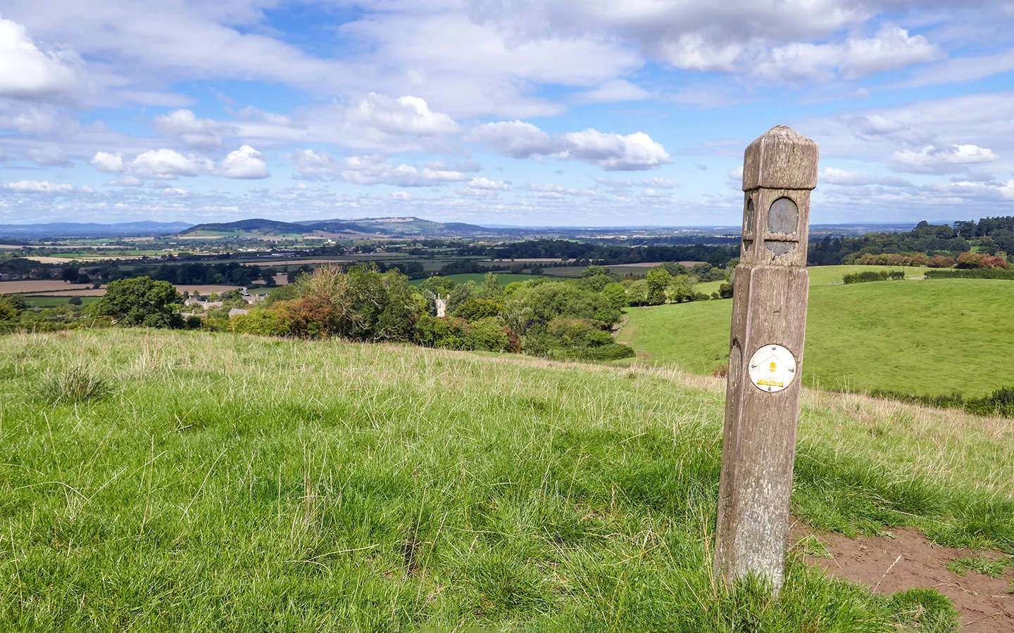 Cotswold Way signpost on the climb up from Wood Stanway