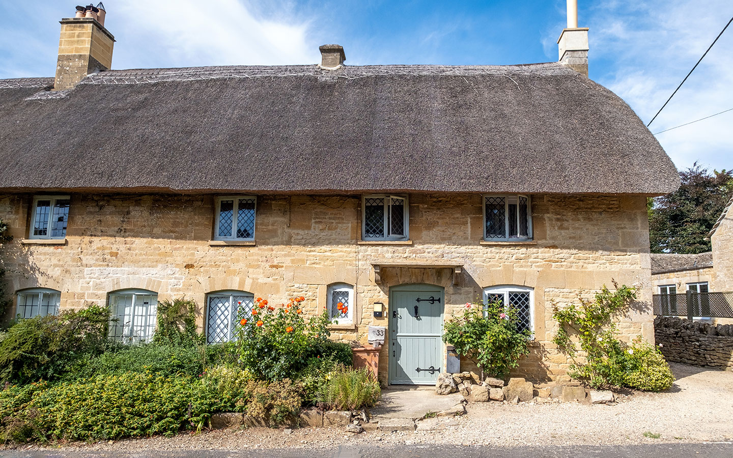 Thatched cottage in Taynton in the Windrush Valley on the Cotswolds Romantic Road 