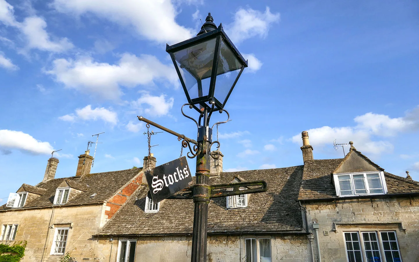 Sign for the town stocks in Painswick