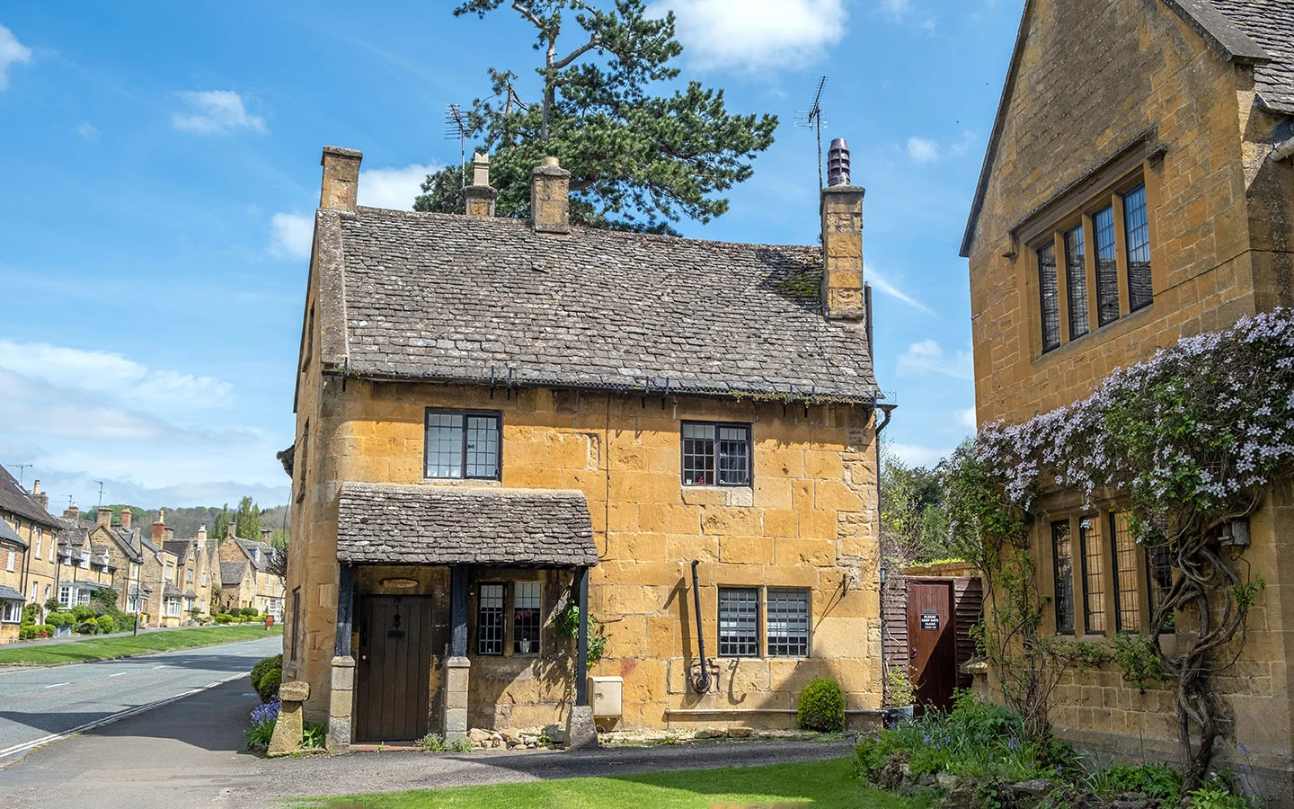 Cotswold stone buildings on the upper High Street in Broadway