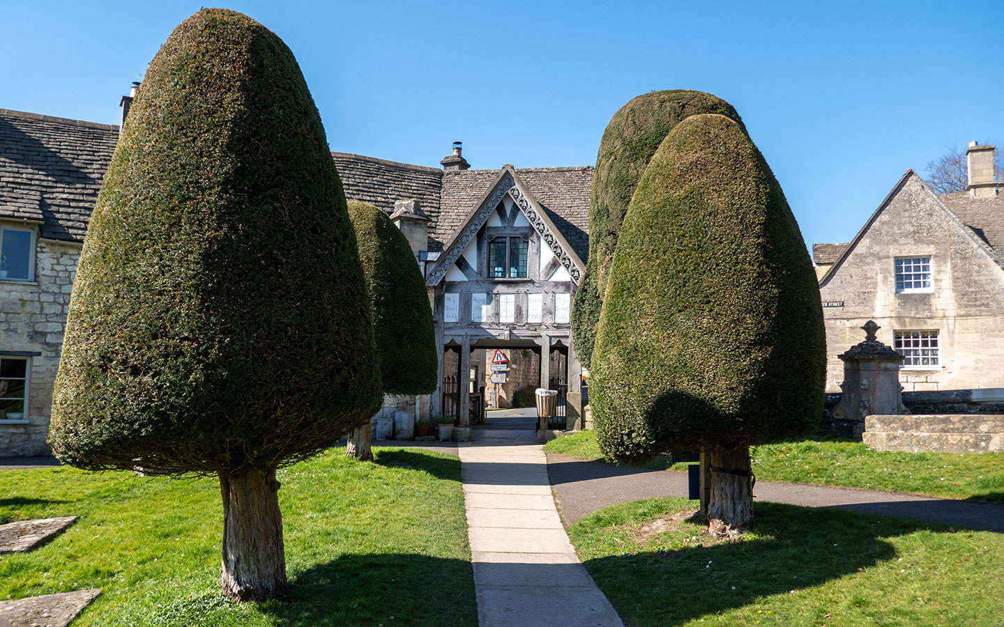 The Lych Gate and yew trees at St Mary's Church in Painswick