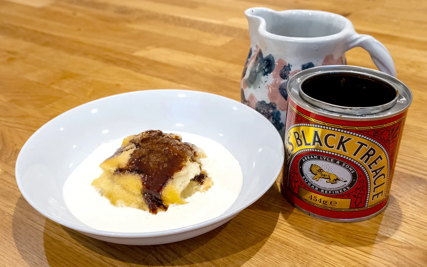 Crundle pudding Cotswold recipe served with black treacle and cream